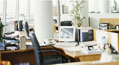Photo of modern office layout with desks and chairs image
